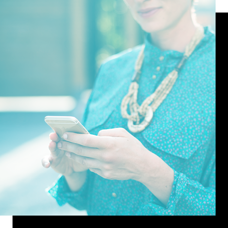 blue tinted image of woman holding cell phone